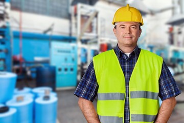 Portrait of factory worker or contractor in petrochemical industrial refinery.