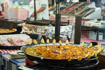 Detail of giant paella at funfair food truck