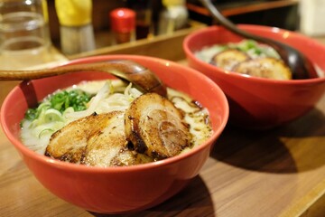 Tonkotsu ramen with grilled chashu slices at a Ramen Sen no Kaze, a casual restaurant in Kawaramachi, Nakanocho, Nakagyo Ward; Kyoto, Japan