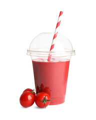 Plastic cup of tasty tomato smoothie and fresh vegetables on white background