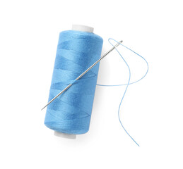 Spool of light blue sewing thread with needle isolated on white, top view