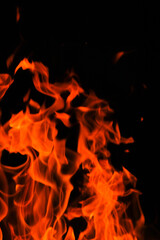  Fire. Flames on a black background. Tongues of flame, sparks close-up.