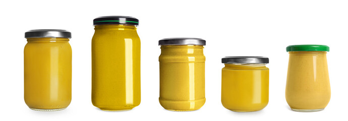Set with different glass jars of spicy mustard on white background. Banner design