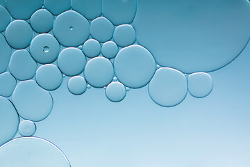 Oil bubbles on pale blue background.