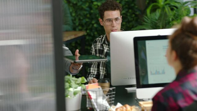 Digital marketing, tablet and computer engineer in collaboration office in teamwork seo web design for startup. Women or creative developer people with chart data analysis of software app on iot tech