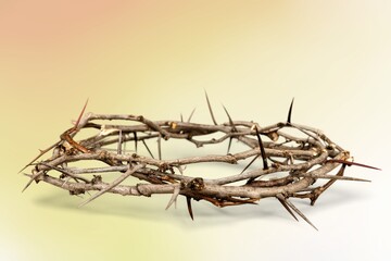 Crown of thorns symbolizing the sacrifice, suffering and resurrection of Jesus Christ on the cross and Easter bright background