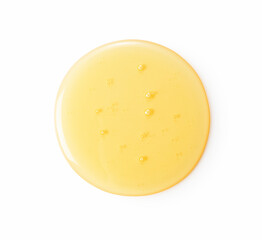 Honey dripping on white background.