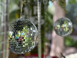 Shimmering Disco Balls Hanging in Outdoor Setting
