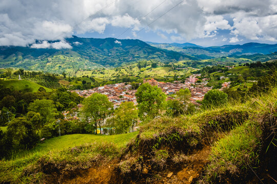 Flying Above Jerico Colombia Colonial Valley Town, Church View in Between Green Mountain Chain and Houses near Medellin