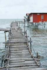 A rustic stilt village of Kampung Tinosan in Sandakan during low tide time.