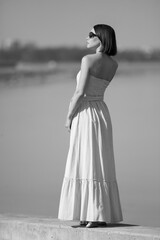 Fototapeta na wymiar young slender woman by the sea