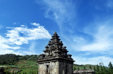 Fototapeta premium Arjuno Temple with a bright blue sky in the background in the Dieng plateau, Wonosobo, Central Java, Indonesia