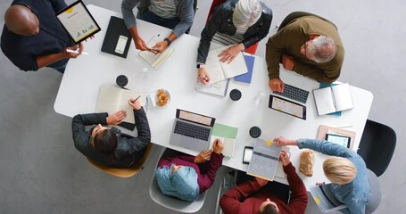 Business team collaboration, planning or teamwork in office with corporate meeting, strategy and innovation creative idea. Digital, paper and diversity in company, marketing or business meeting - Powered by Adobe