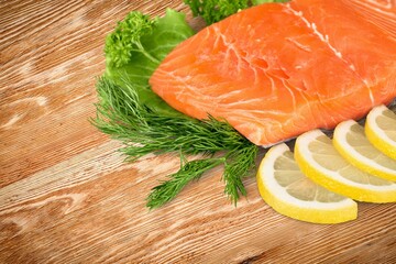 Fresh tasty fish for cooking dish on table with lemon