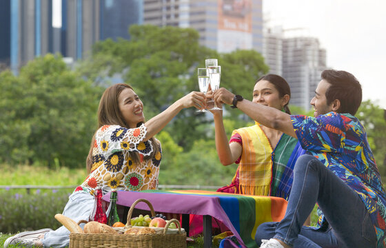 Group Of Lgbt Friends Meeting And Having A Drink Together In The Park On Vacation, Selective Focus. Concept Of Lgbtq Lifestyle,life,lgbtq Community