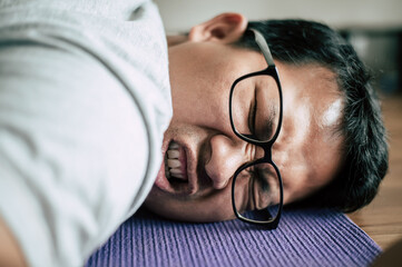 Young fat man exhausted down after workout