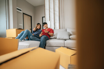 Young couple checking boxs relocation in new house