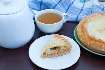 Plates with tasty apple pie on table.