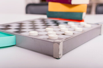 Checkers game. Pieces are placed on game board and everything is ready for start of set.