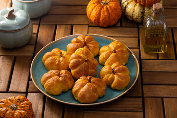 Pumpkin buns on a wooden table