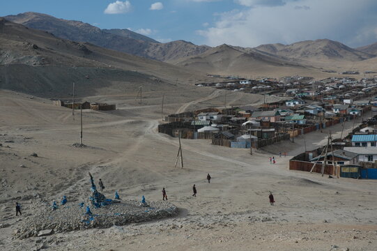 Tent (ger) communities in the solitude of the sandy valley, Zavkhan, Mongolia. The life in the nomadic communities around the valley seems to be slow. Local people enjoy the moments of their lives.