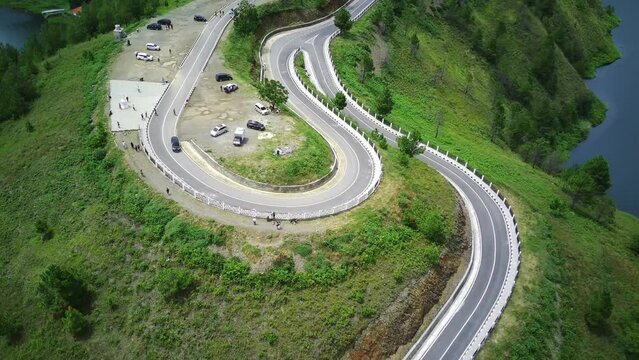 Aerial shot on Bukit Sibea bea or Sibea bea hill with the winding roads by the lake Toba in Samosir North Sumatra Indonesia