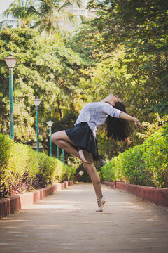 Ballet dancer dancing in park