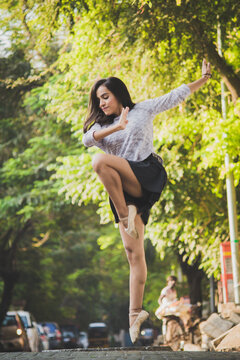 Ballet dancer practicing in street