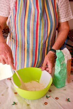 Cropped image of woman making a dough