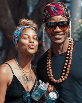 Man and a woman in bandanas smiling