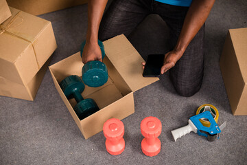 Person packing dumbbells