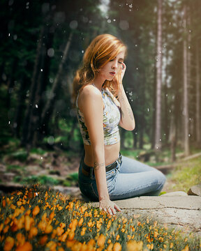 Portrait of woman sitting in nature