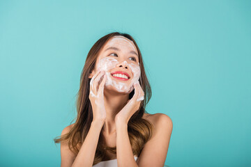 Asian woman face wash exfoliate scrub soap foam with skincare cleansing, Portrait beautiful female...