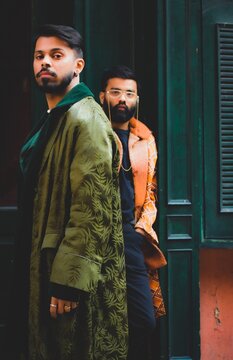 Two Men Wearing Coats Standing Outdoor