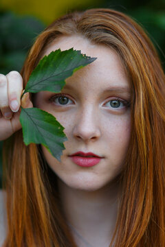 Woman Holding Green Leaf