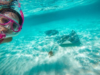 Woman in pink goggles in water
