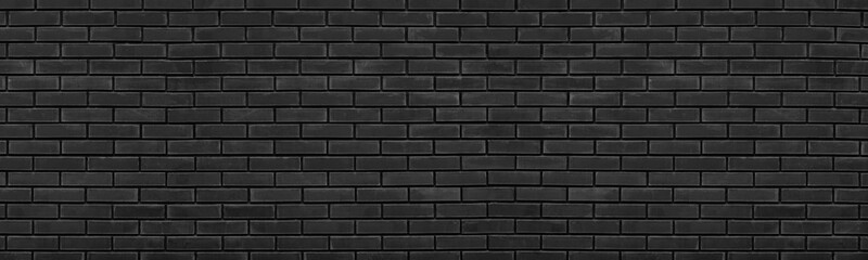 Old black brick wall wide texture. Dark shabby brickwork grunge panoramic background