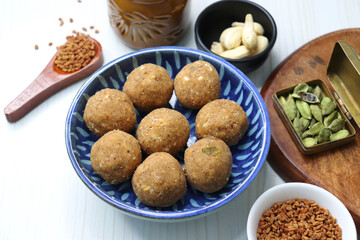 Gond and Methi Ke Laddu or Pinni. Fenugreek Laddu Made From Fenugreek Seeds, Saunf, Jaggery, and nuts. Immunity booster food for winters. Copy space