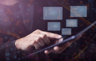 Woman using tablet on dark background. Displays through a virtual screen. Communication and connection of the future world.