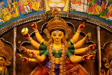 Idol of Goddess Devi Durga at a decorated puja pandal in Kolkata, West Bengal, India. Durga Puja is...