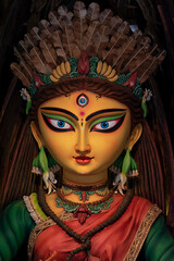 Idol of Goddess Devi Durga at a decorated puja pandal in Kolkata, West Bengal, India. Durga Puja is a famous and major religious festival of Hinduism that is celebrated throughout the world.