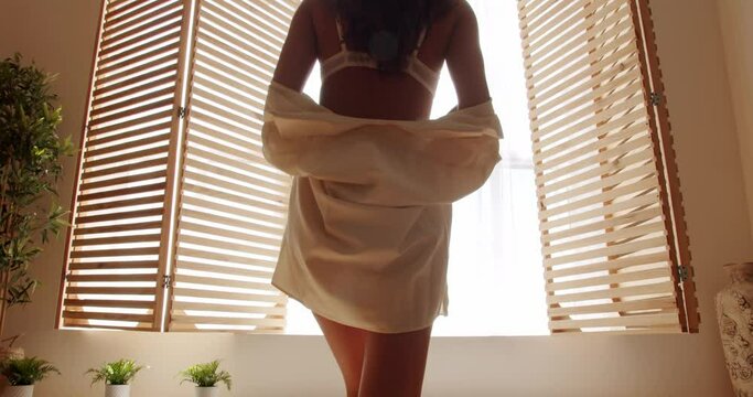 Beautiful Hot lady in elegant lingerie. slim waist, sensual girl. Sexy young woman in white lingerie. Sensual waist. Beautiful sexy girl posing in lingerie and looks in camera.Sexy girl goes on a date