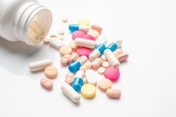 Vitamin, different color tablets and Pill capsule on white background,health care concept