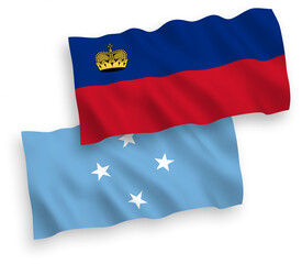 Obraz premium National vector fabric wave flags of Federated States of Micronesia and Liechtenstein isolated on white background. 1 to 2 proportion.