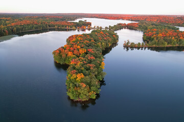 Kensington Metro park in Michigan, Colorful fall foliage on a small island in the middle of Kent...