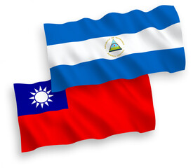 National vector fabric wave flags of Nicaragua and Taiwan isolated on white background. 1 to 2 proportion.