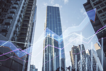 Real estate market growth concept digital blue transparent rising arrows and financial chart graphs on city skyscrapers background, double exposure