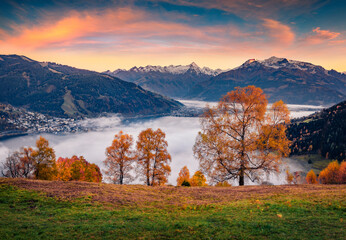 Zell lake in the morning mist. Foggy autumn sunrise on Austrian town - Zell am See, south of the...