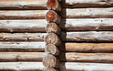 Wooden logs on the wall from the log house.