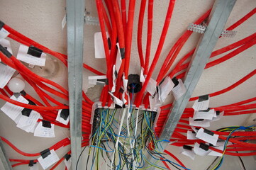 Electrical wires on an old concrete building wall